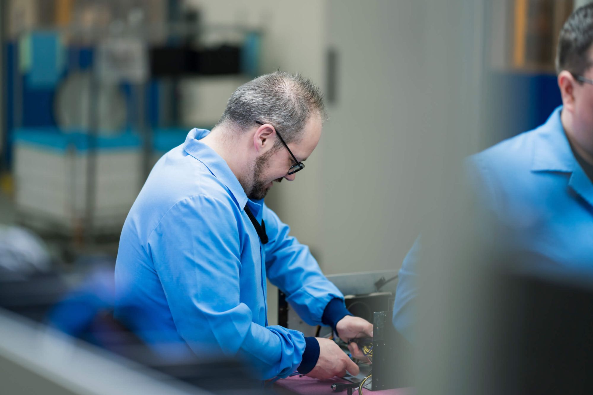 man-smiling-at-desk-working.jpg